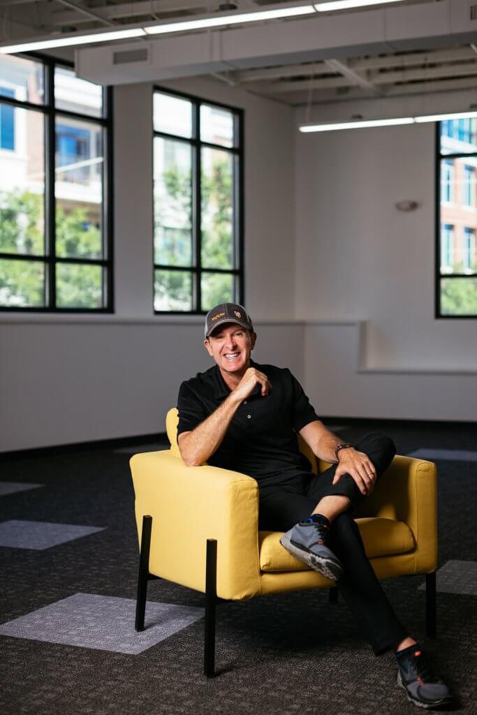 photo of app creator thinking in a chair